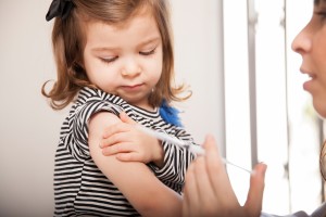 bigstock-Little-Girl-Getting-A-Flu-Shot-80821685web