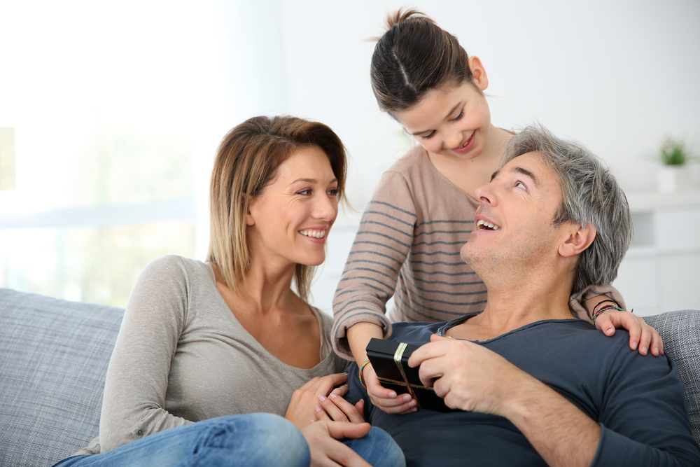 Woman with daughter celebrating father's day